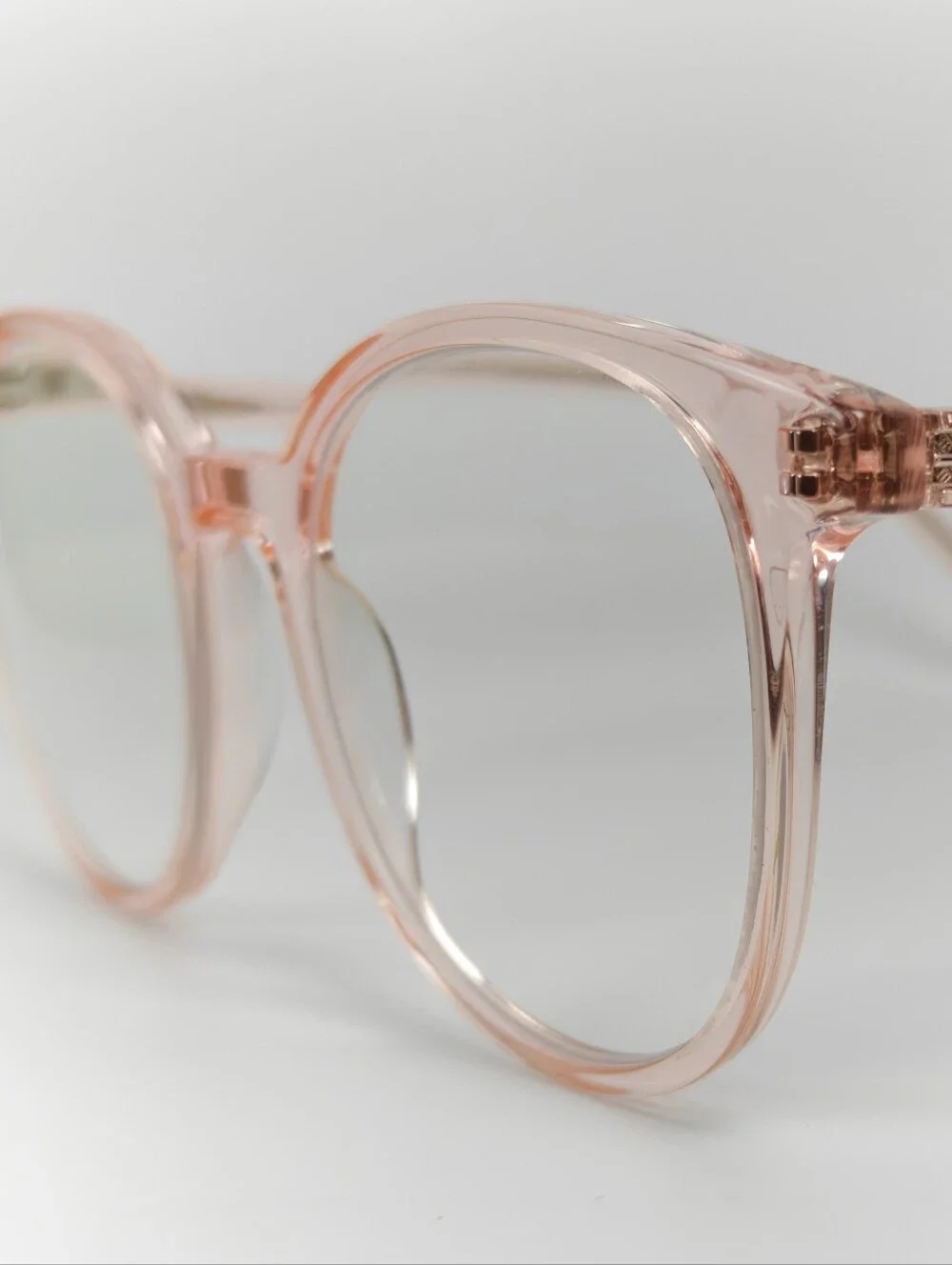 Noun. Transparent Pink Round Women's Eyeglasses. Minimalist..